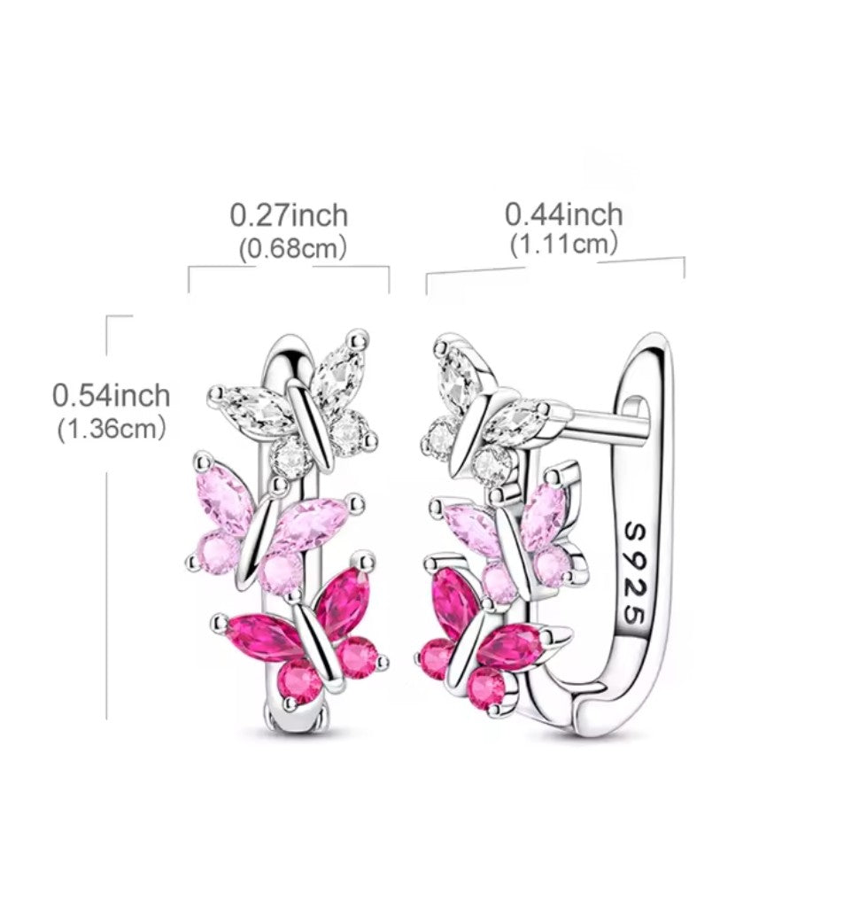 Butterfly-shaped earrings with pink stones and silver hooks, shown with measurements on a white background.