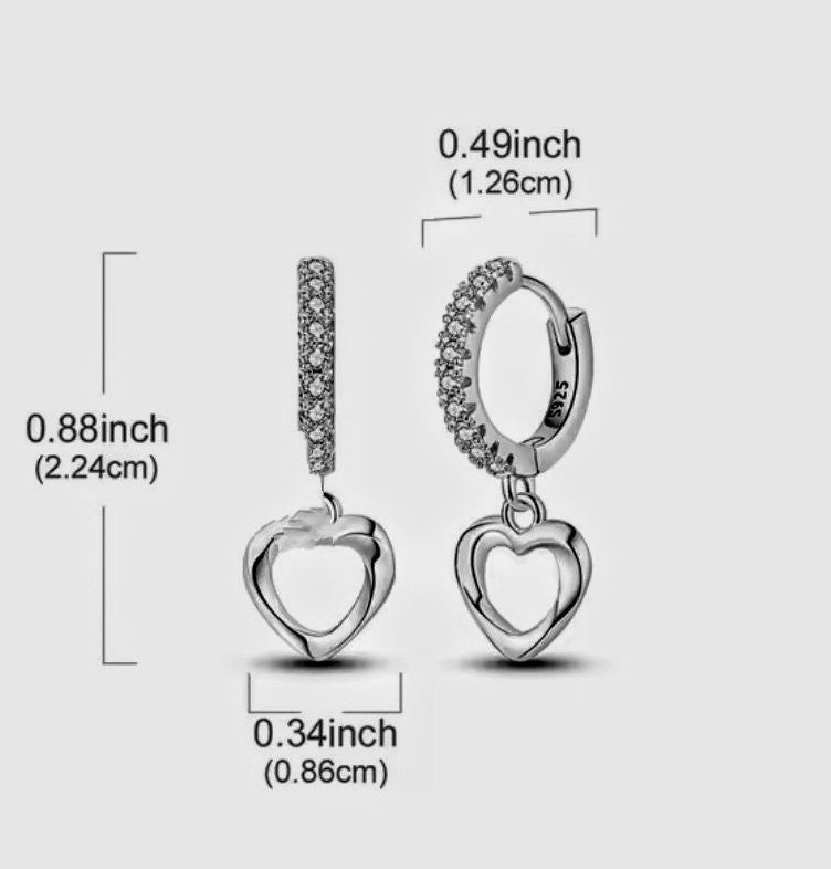 Heart-shaped earrings with measurements on a light gray background